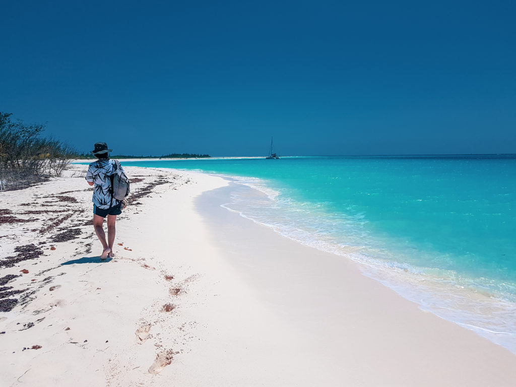Man walking at Playa Paraiso Cayo on a 1 day trip to Cayo Largo Cuba