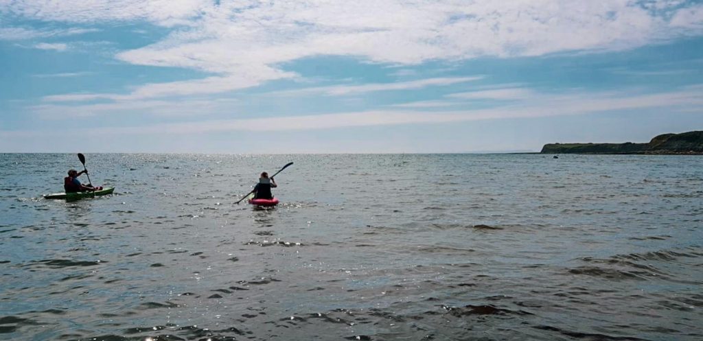 kayak on the water in kimmeridge bay dorset england jurassic coast outdoor activities